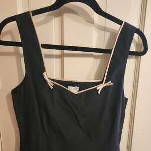 Anthropologie black corset top with pink  trim and bow detail